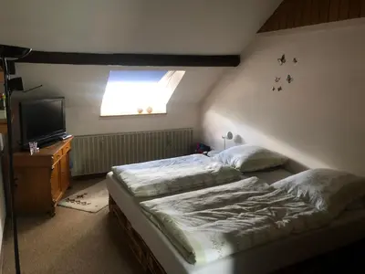 Ein Bett oder Betten in einem Zimmer der Unterkunft Ironico Homestay 4 Schlafzimmer Ferienwohnung 100 m2 nahe Bostalsee