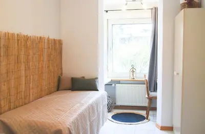 Ein Bett oder Betten in einem Zimmer der Unterkunft Gästehaus an der Moseltherme