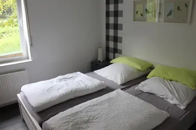 Ein Bett oder Betten in einem Zimmer der Unterkunft Ferienwohnung Sponheim