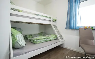 Ein Bett oder Betten in einem Zimmer der Unterkunft Ferienwohnung / Haus Hunsrückblick