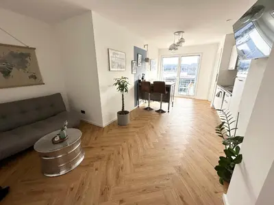 Ein Sitzbereich in der Unterkunft Wonderful World Apartment - stadtnah, Balkon, Parkplatz, E-Ladestation, Fitnessstudio