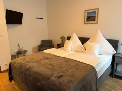 Ein Bett oder Betten in einem Zimmer der Unterkunft RATSKELLER Hotel & Restaurant