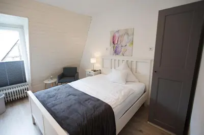Ein Bett oder Betten in einem Zimmer der Unterkunft RATSKELLER Hotel & Restaurant