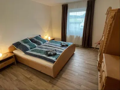 Ein Bett oder Betten in einem Zimmer der Unterkunft Relaxen am Ring Fewo 1