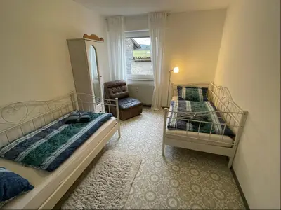 Ein Bett oder Betten in einem Zimmer der Unterkunft Relaxen am Ring Fewo 1