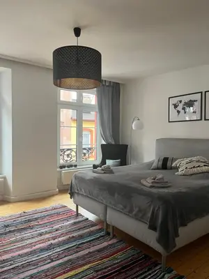 Ein Bett oder Betten in einem Zimmer der Unterkunft Stilvolle Altstadtwohnung mit 2 Schlafzimmern