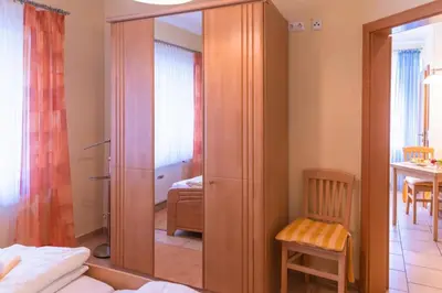 Ein Bett oder Betten in einem Zimmer der Unterkunft Ferienwohnung 4 Am Petersberg