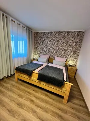 Ein Bett oder Betten in einem Zimmer der Unterkunft O&W Ferienzimmer am Nürburgring, Quiddelbach