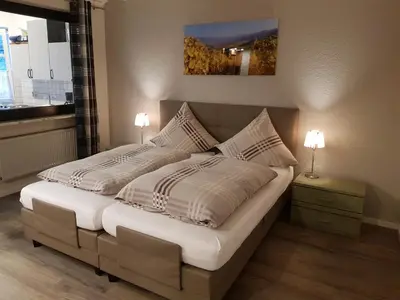 Ein Bett oder Betten in einem Zimmer der Unterkunft Gästehaus Vinum