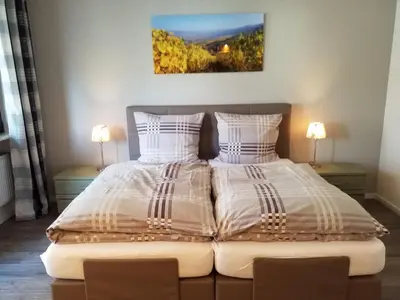 Ein Bett oder Betten in einem Zimmer der Unterkunft Gästehaus Vinum