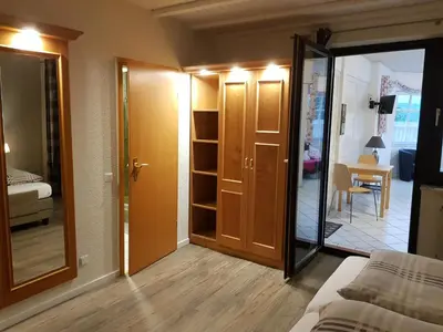 Ein Bett oder Betten in einem Zimmer der Unterkunft Gästehaus Vinum