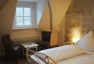 Ein Bett oder Betten in einem Zimmer der Unterkunft Gästehaus Weingut Schier im Zehnthof
