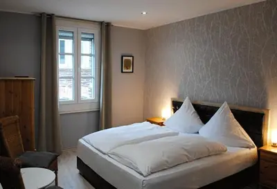 Ein Bett oder Betten in einem Zimmer der Unterkunft Gästehaus Weingut Schier im Zehnthof