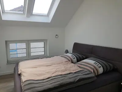 Ein Bett oder Betten in einem Zimmer der Unterkunft Studio EifelGlück