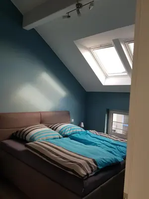 Ein Bett oder Betten in einem Zimmer der Unterkunft Studio EifelGlück