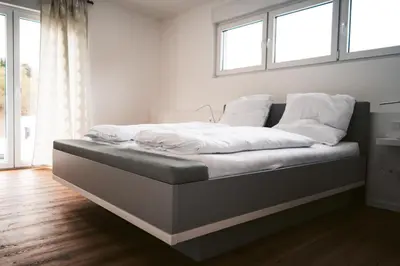 Ein Bett oder Betten in einem Zimmer der Unterkunft Weingut Meurer