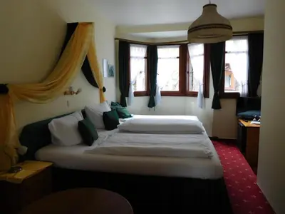 Ein Bett oder Betten in einem Zimmer der Unterkunft Kranenturm hotel
