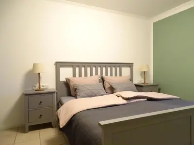 Ein Bett oder Betten in einem Zimmer der Unterkunft Ferienwohnung Haus Weinbergsblick