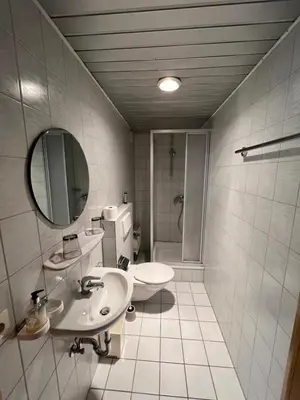 Ein Badezimmer in der Unterkunft Pension Cafe Braun