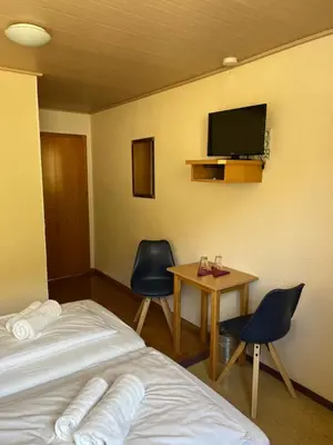 Ein Bett oder Betten in einem Zimmer der Unterkunft Pension Cafe Braun