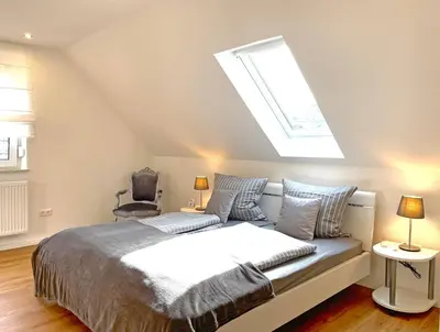 Ein Bett oder Betten in einem Zimmer der Unterkunft Altes Winzerhaus am Moselufer - Klosterberg