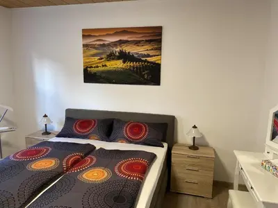 Ein Bett oder Betten in einem Zimmer der Unterkunft Ferienhaus Wolle & Beate