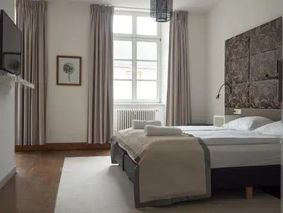Ein Bett oder Betten in einem Zimmer der Unterkunft Hotel Lekker