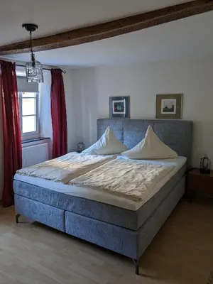 Ein Bett oder Betten in einem Zimmer der Unterkunft Kruft Veldenz