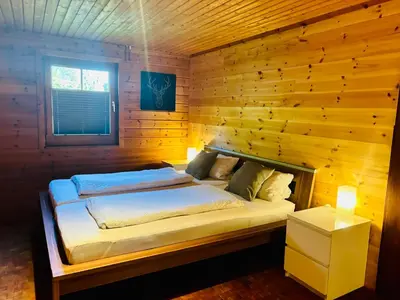 Ein Bett oder Betten in einem Zimmer der Unterkunft Blockhütte Engeln-Eifel