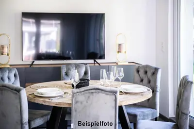 Ein Sitzbereich in der Unterkunft Nells Park Hotel Ferienwohnungen