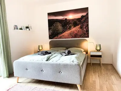 Ein Bett oder Betten in einem Zimmer der Unterkunft Home away from Home in a lovely vine region Bingen
