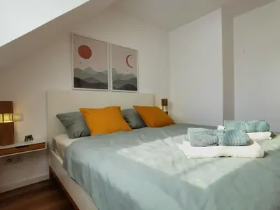 Ein Bett oder Betten in einem Zimmer der Unterkunft Ferienwohnung Koblenz Goldgrube