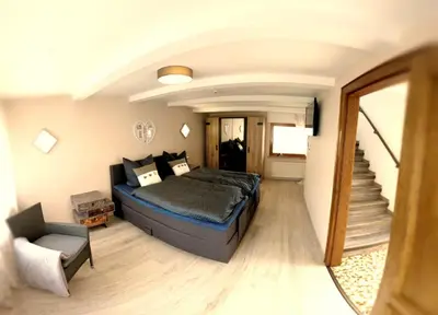 Ein Bett oder Betten in einem Zimmer der Unterkunft Ferienhaus Zum Hochstein