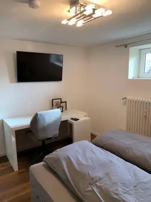 Ein Bett oder Betten in einem Zimmer der Unterkunft Ruhiges Business-Studio I Nähe WHU I WLAN