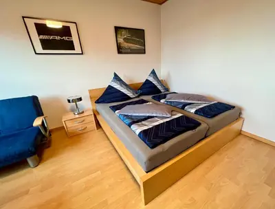 Ein Bett oder Betten in einem Zimmer der Unterkunft Ferienwohnung Terrasse Parkplatz WallBox Nürburgring
