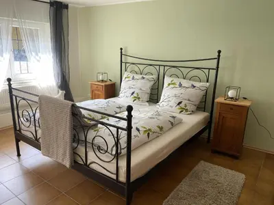 Ein Bett oder Betten in einem Zimmer der Unterkunft Ferienwohnung im Brohlbachtal