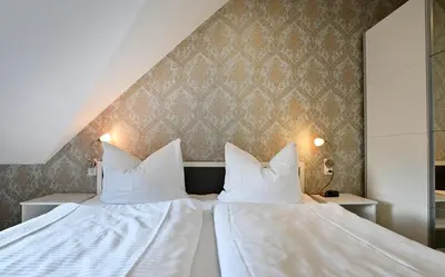 Ein Bett oder Betten in einem Zimmer der Unterkunft Ferienwohnungen by Weingut Hommes in Ernst Mosel