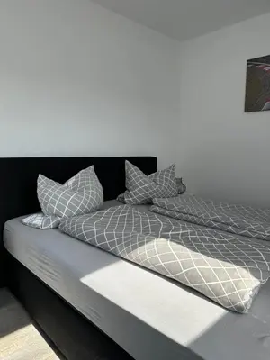 Ein Bett oder Betten in einem Zimmer der Unterkunft Deluxe Am Ring