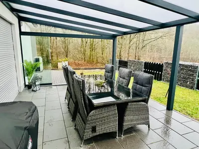 Ein Sitzbereich in der Unterkunft Ferienhaus Waldblick