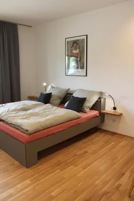 Ein Bett oder Betten in einem Zimmer der Unterkunft Ferienwohnungen Faulhauer