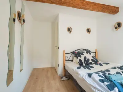 Ein Bett oder Betten in einem Zimmer der Unterkunft Cosy holiday home in Sankt Goarshausen with barbecue
