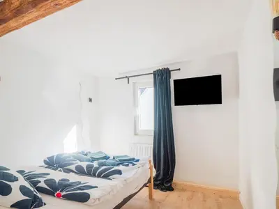 Ein Bett oder Betten in einem Zimmer der Unterkunft Exklusives Ferienhaus in Sankt Goarshausen am Rhein