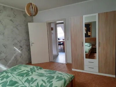 Ein Bett oder Betten in einem Zimmer der Unterkunft Ferienwohnungen Joop