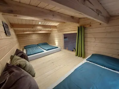 Ein Bett oder Betten in einem Zimmer der Unterkunft Chalet im Spiel- und Obstgarten