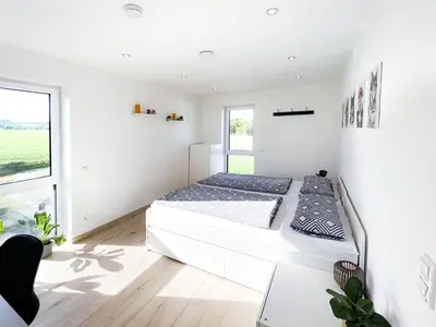 Ein Bett oder Betten in einem Zimmer der Unterkunft The View Suite