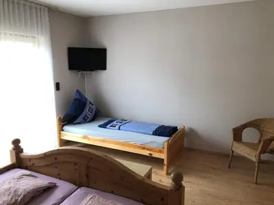 Ein Bett oder Betten in einem Zimmer der Unterkunft Gästehaus Lara