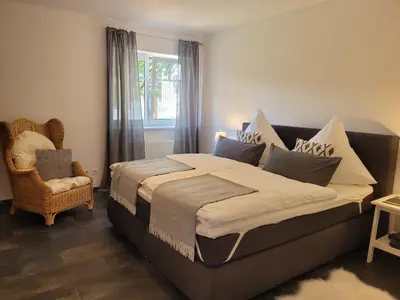 Ein Bett oder Betten in einem Zimmer der Unterkunft Ferienwohnung MIA