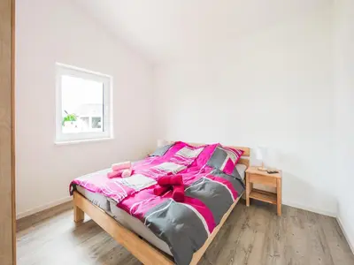 Ein Bett oder Betten in einem Zimmer der Unterkunft Ferienhaus Eifelruhe in Filz