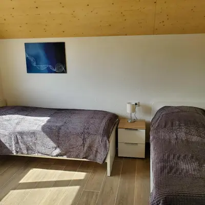 Ein Bett oder Betten in einem Zimmer der Unterkunft Ferienhäuser Prüm