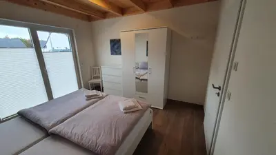 Ein Bett oder Betten in einem Zimmer der Unterkunft Ferienhäuser Prüm